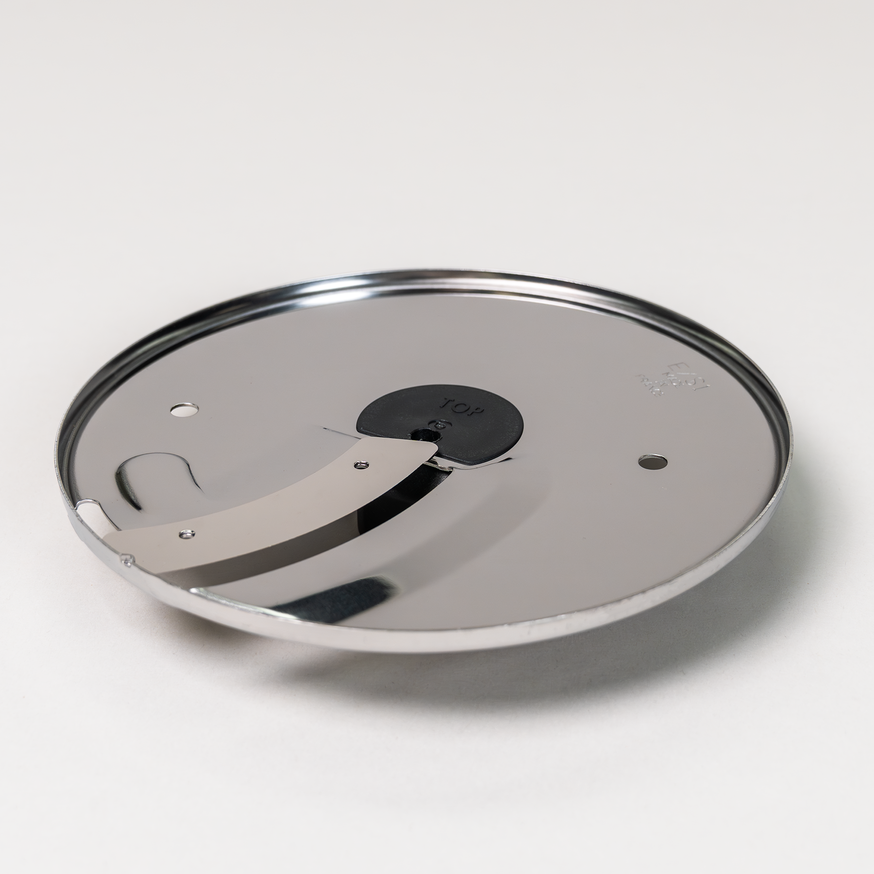 Magimix 1mm slicing disk on a grey background