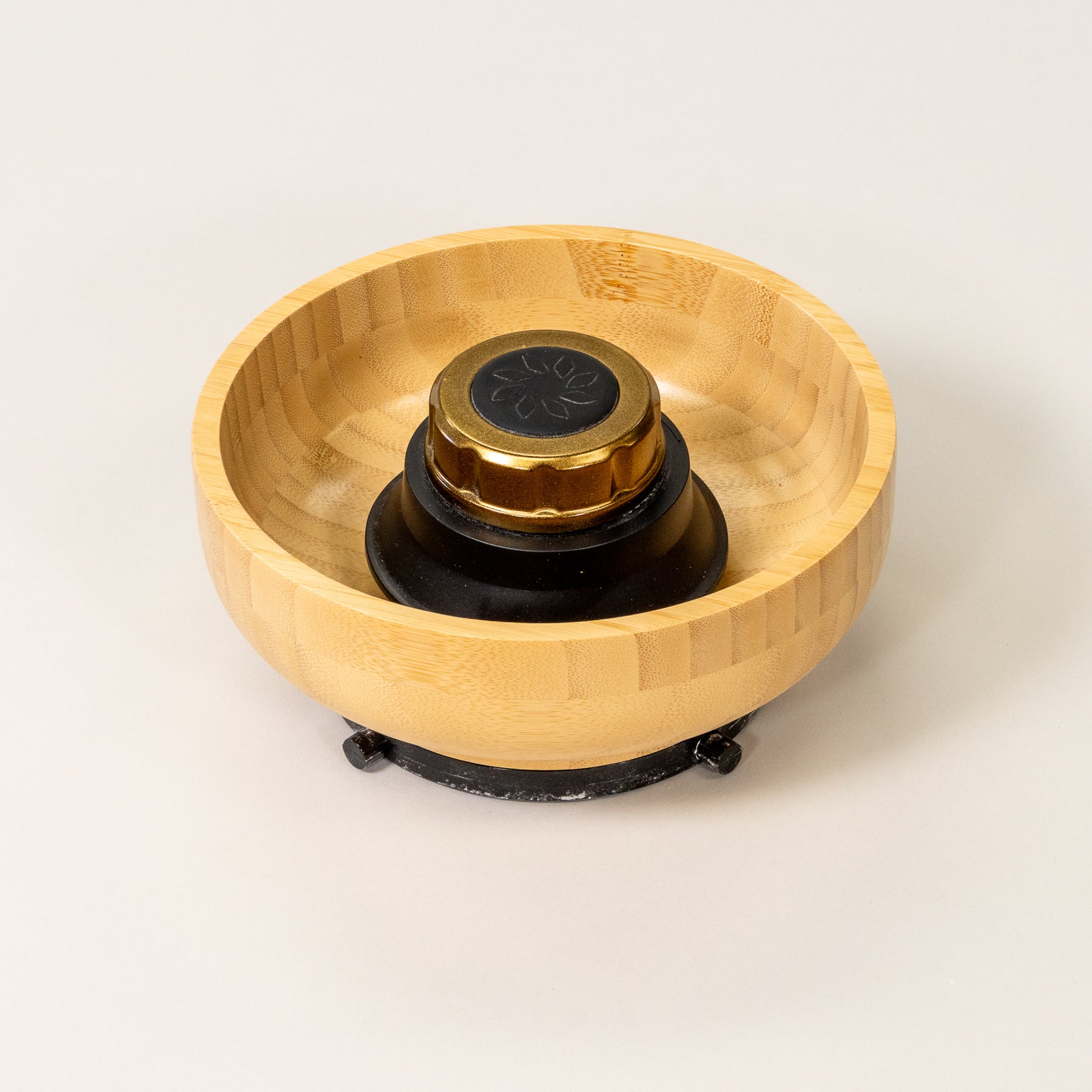 NutriMill harvest gold trim bamboo hopper bowl on grey background