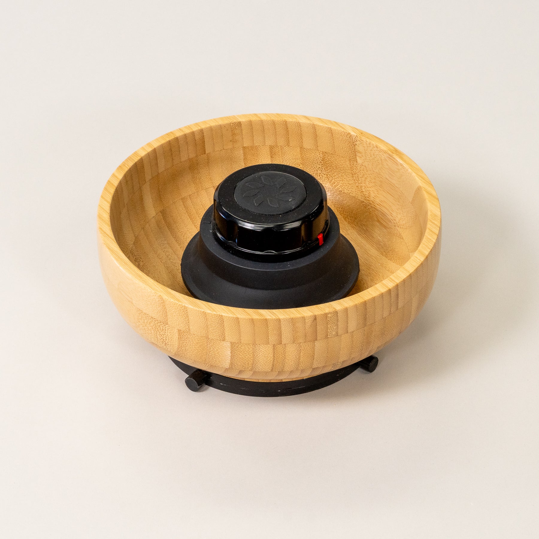 NutriMill harvest black trim bamboo hopper bowl on grey background