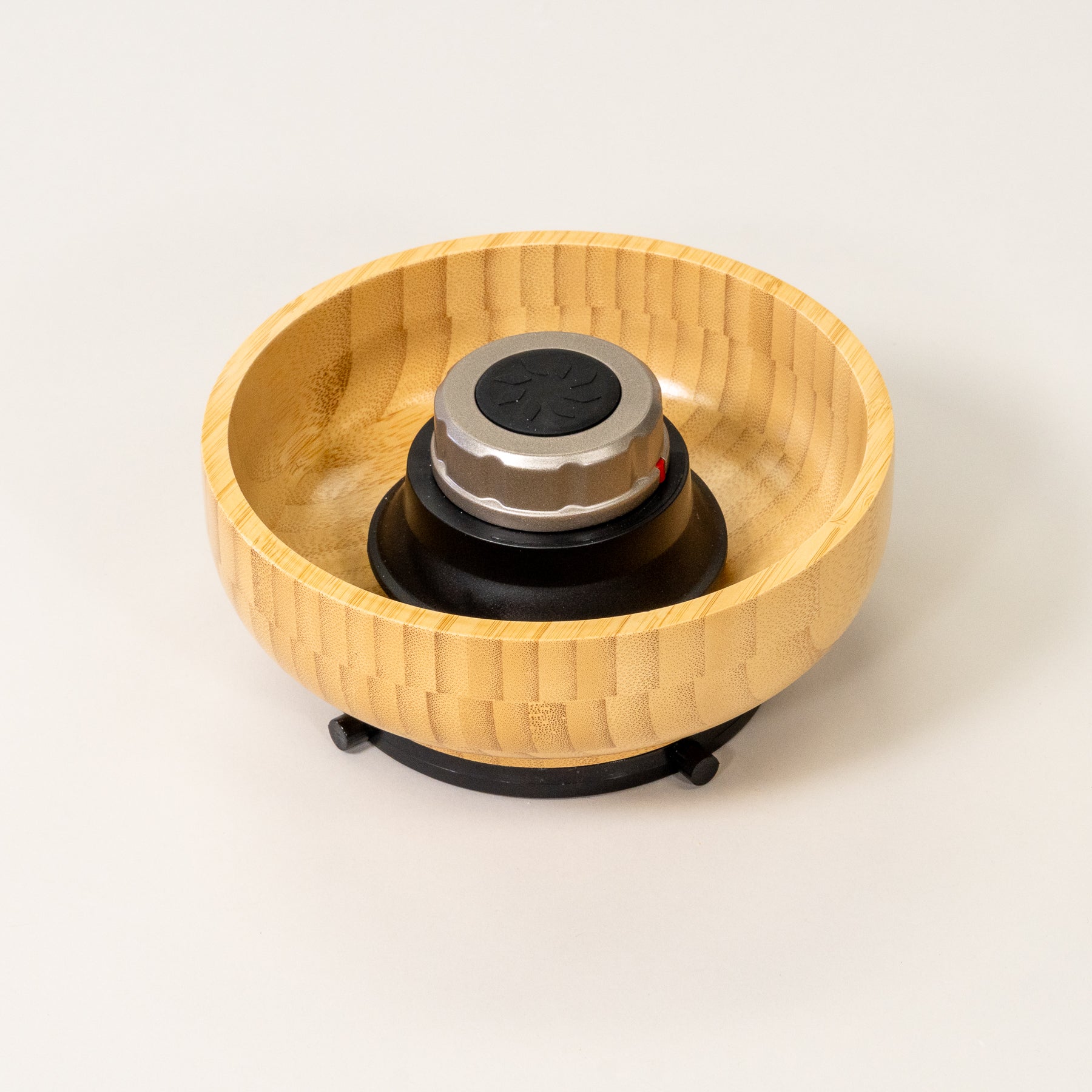 NutriMill harvest silver trim bamboo hopper bowl on grey background