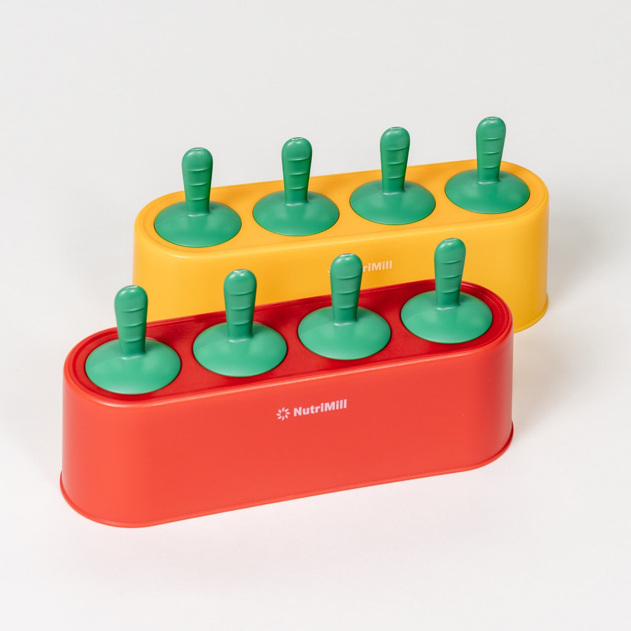 Yellow and red popsicle molds with green handles on a white background