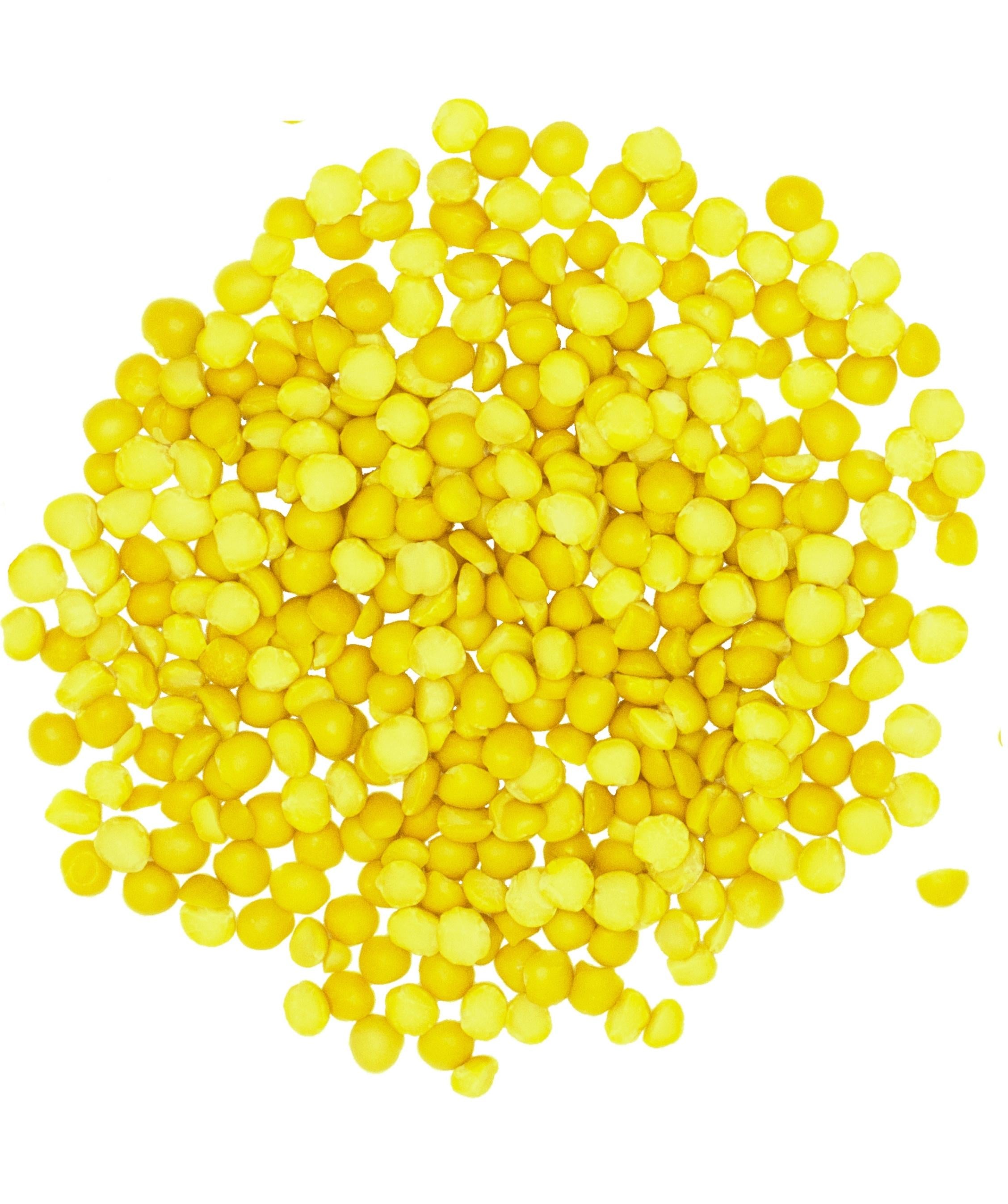 Top view of dried Clear Creek yellow split peas piled on a white background