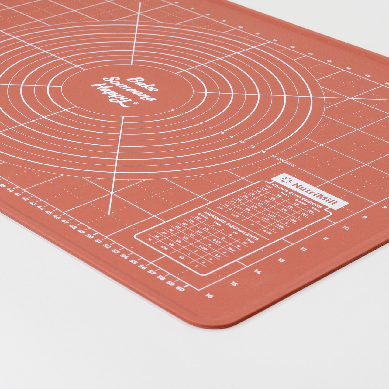 Baking mat with measurement markings on a plain background