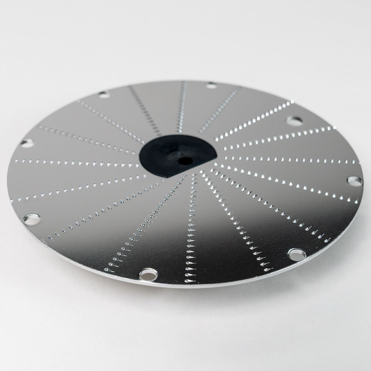 Magimix horseradish disk on a grey background