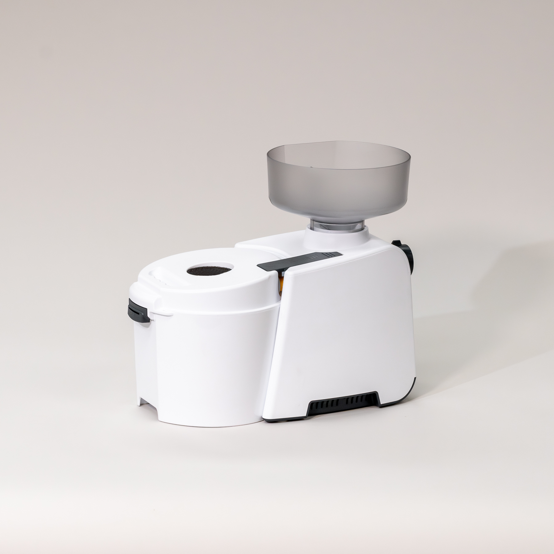 White Impact Grain Mill kitchen appliance with a transparent hopper on a light gray background