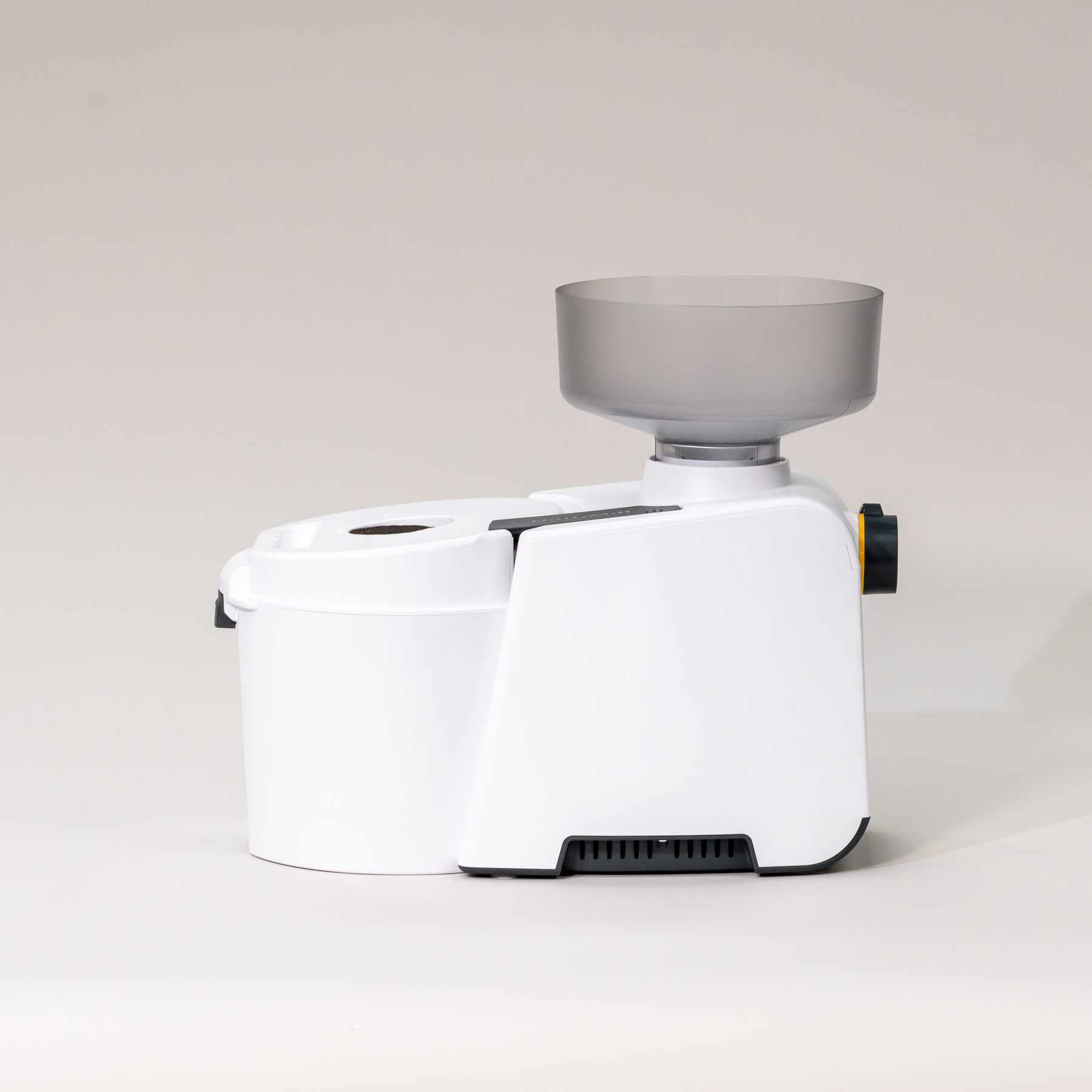 NutriMill Impact Grain Mill on a light gray background