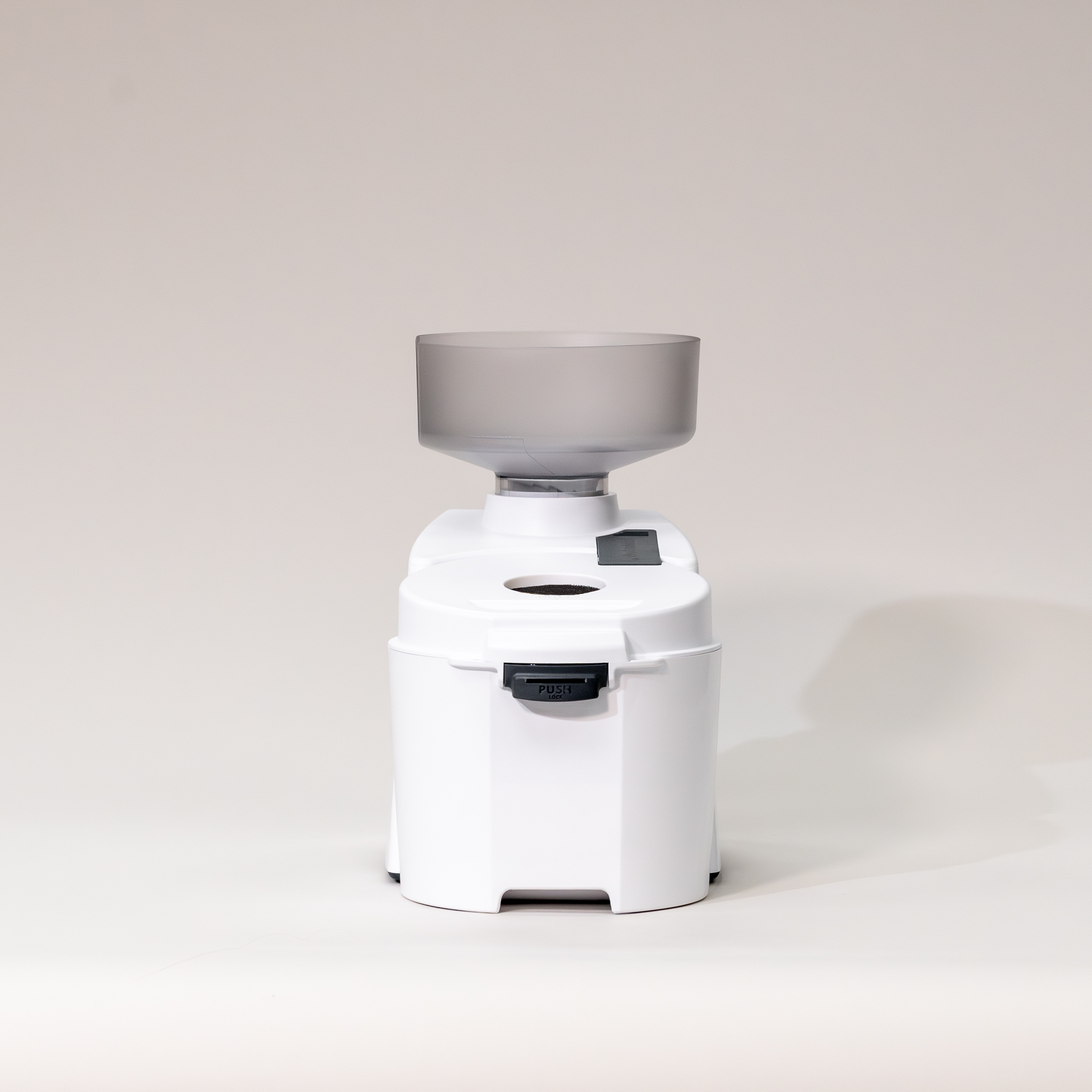 Impact Grain mill on a light gray background