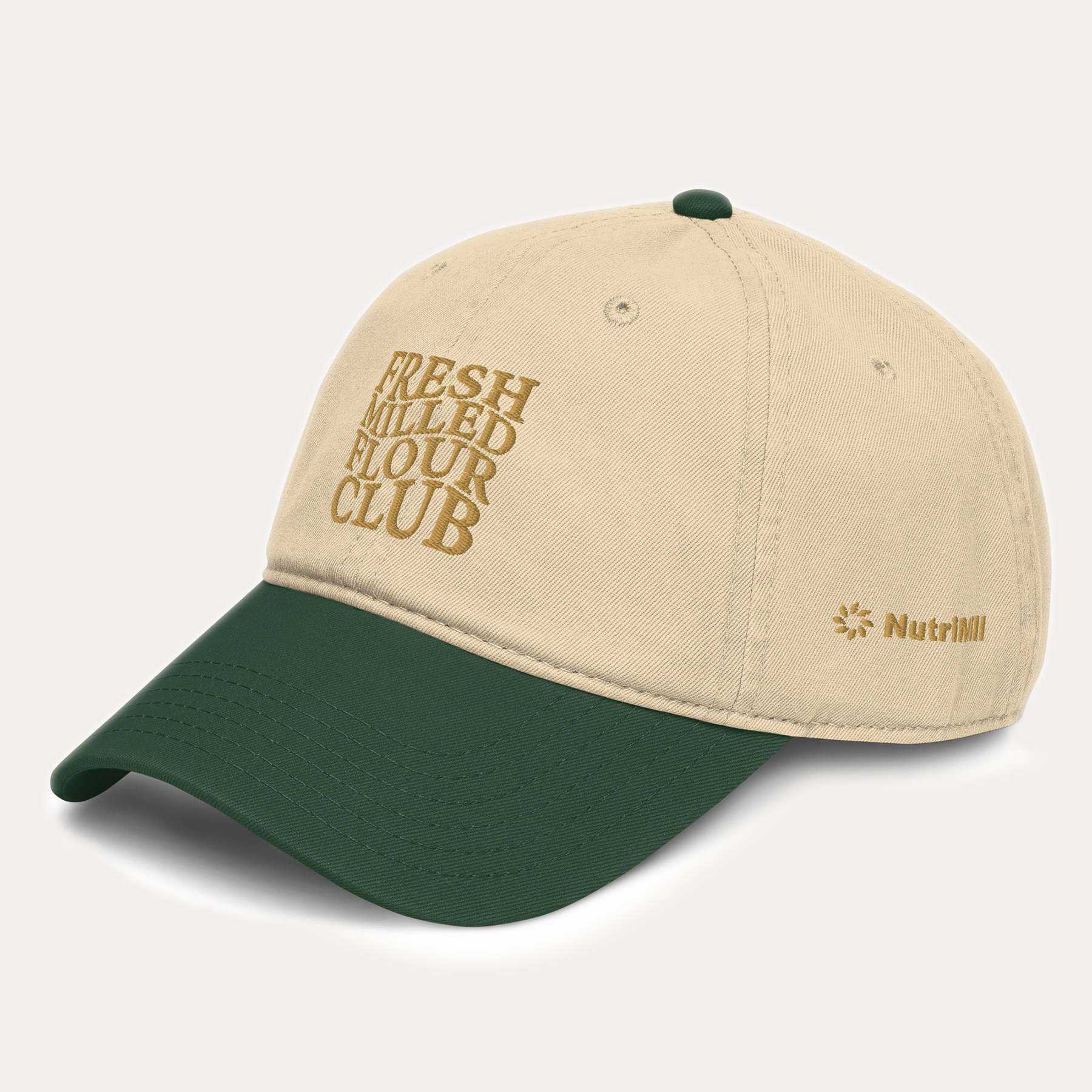 NutriMill beige and green cap with 'Fresh Milled Flour Club' text on a light gray background