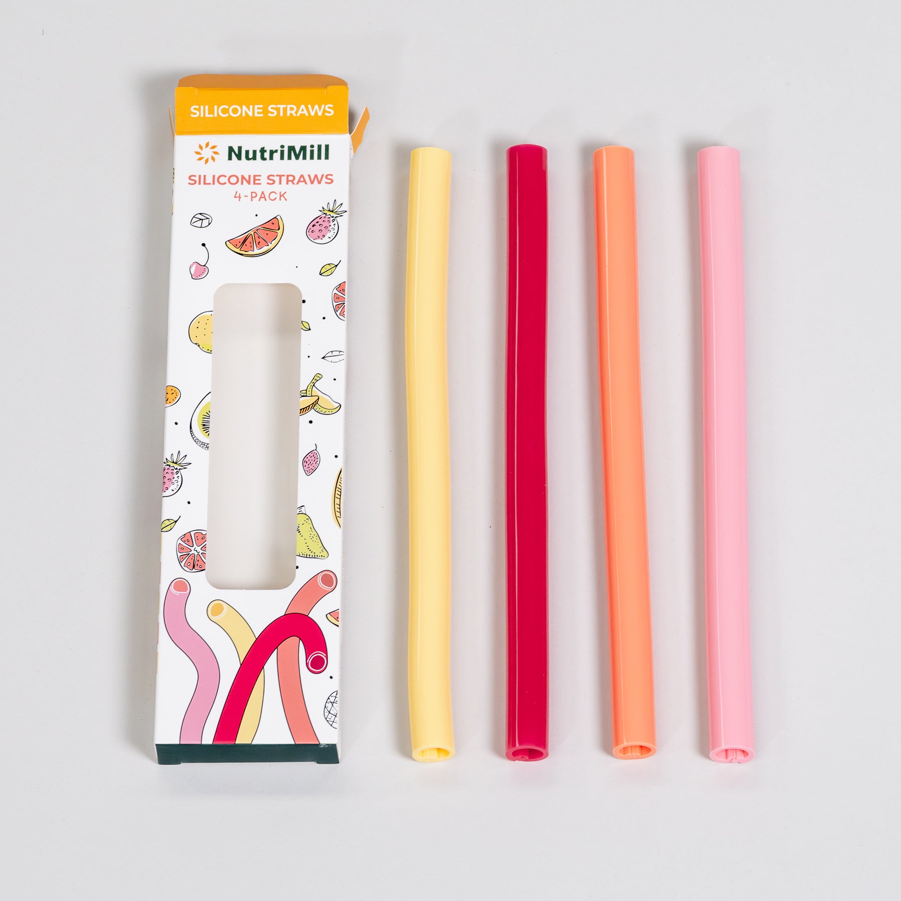 Silicone straws in various colors with packaging on a light gray background