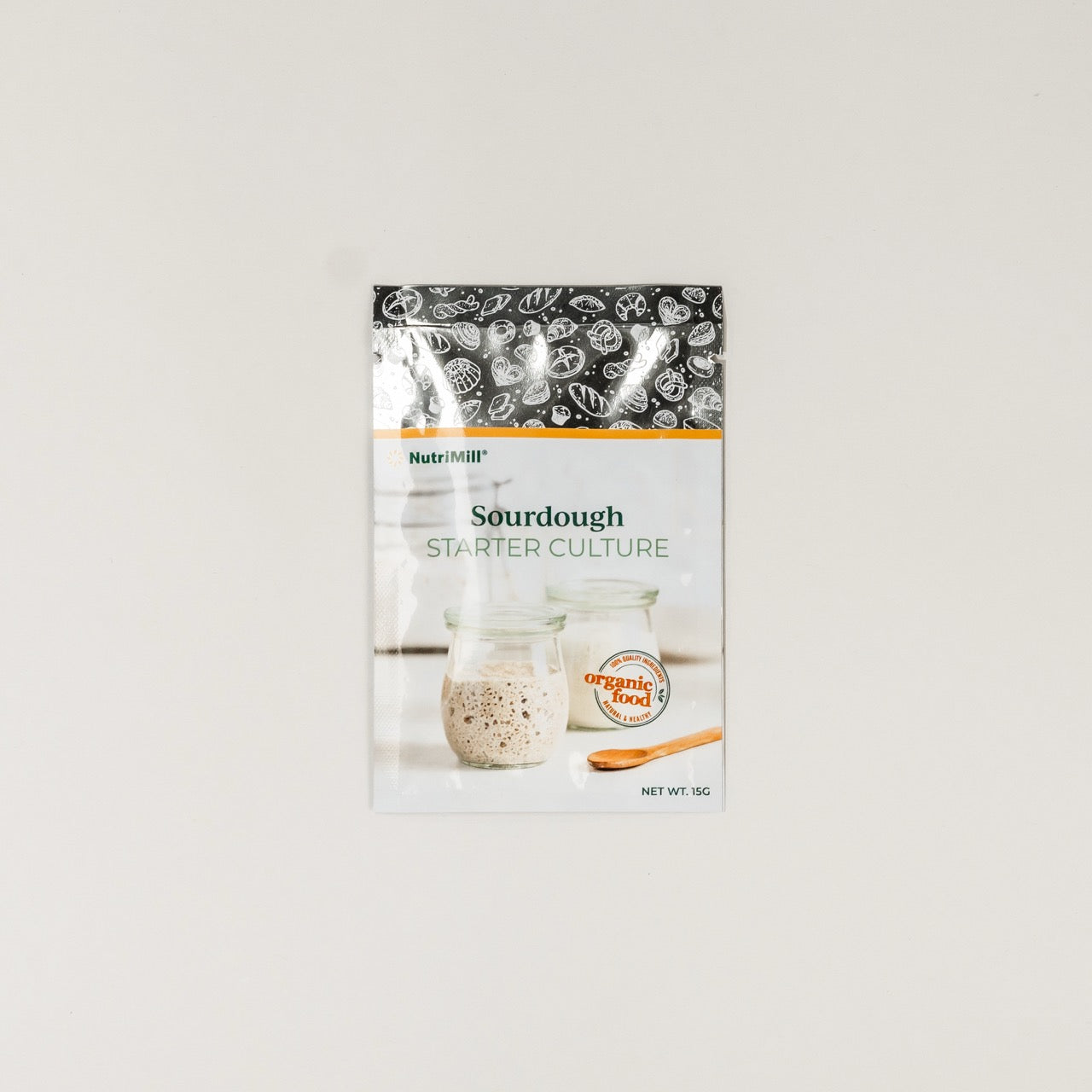 Packaging of Sourdough Starter placed on a plain background.