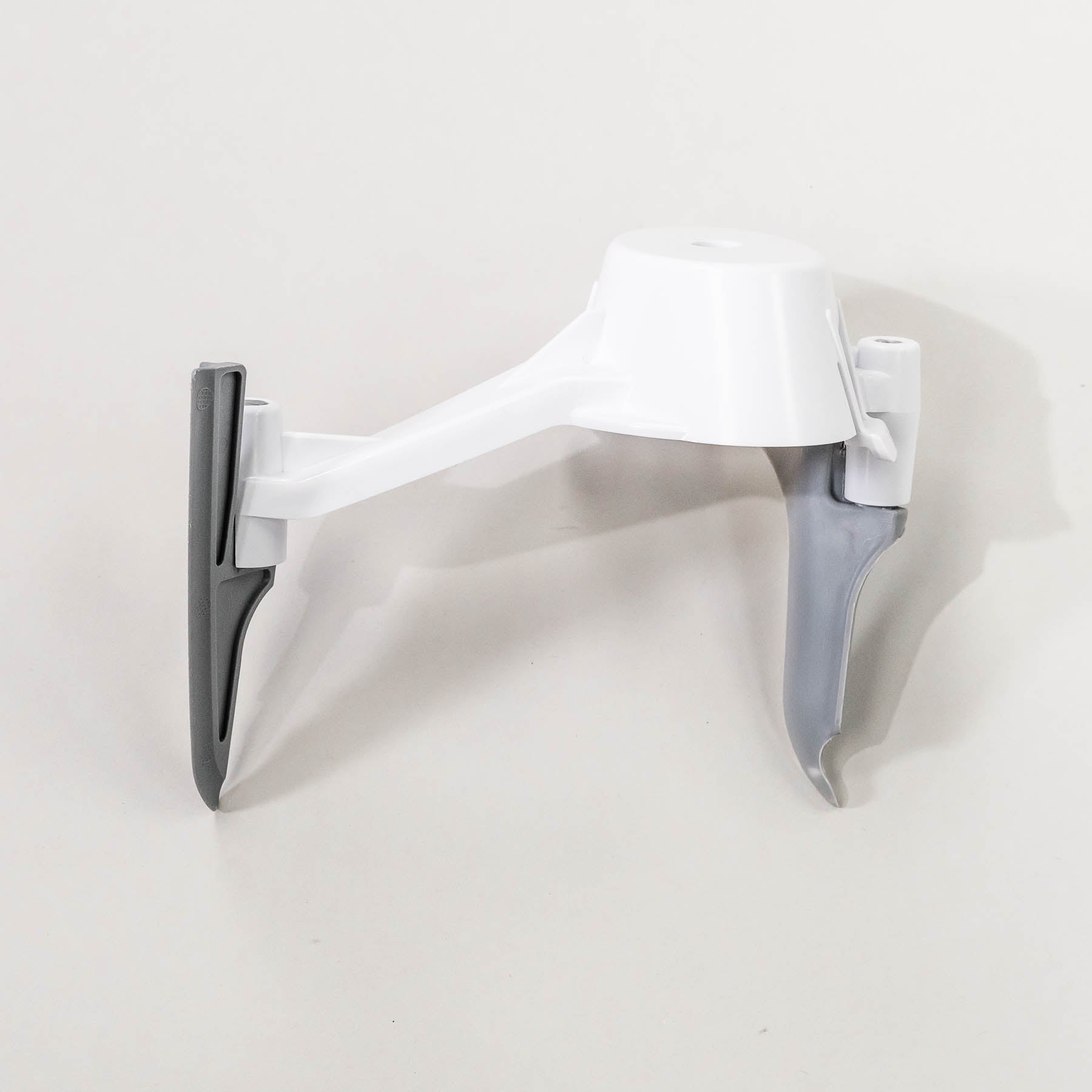 A white and gray bowl scraper attachment for a stand mixer.