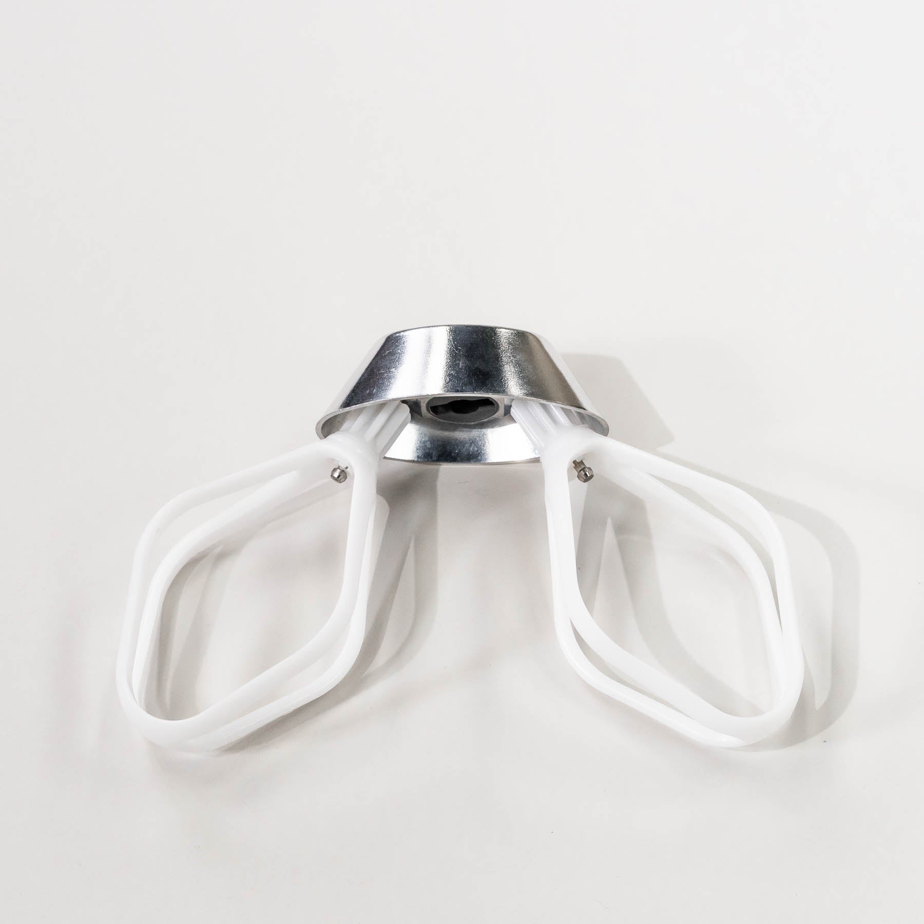 A set of cake paddles with a metal whip driver, designed for mixing cake batter.