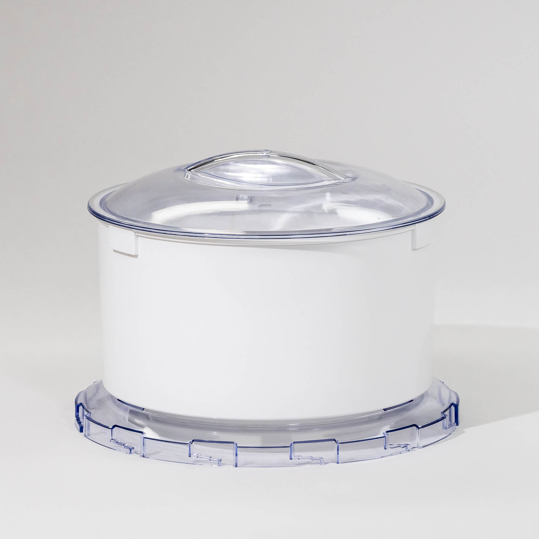 A white flour sifter attachment for a stand mixer with a clear lid.