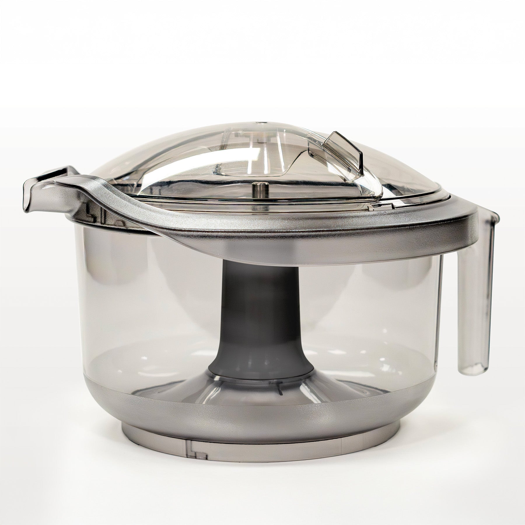 Clear bowl with lid and black center column, sitting on grey background