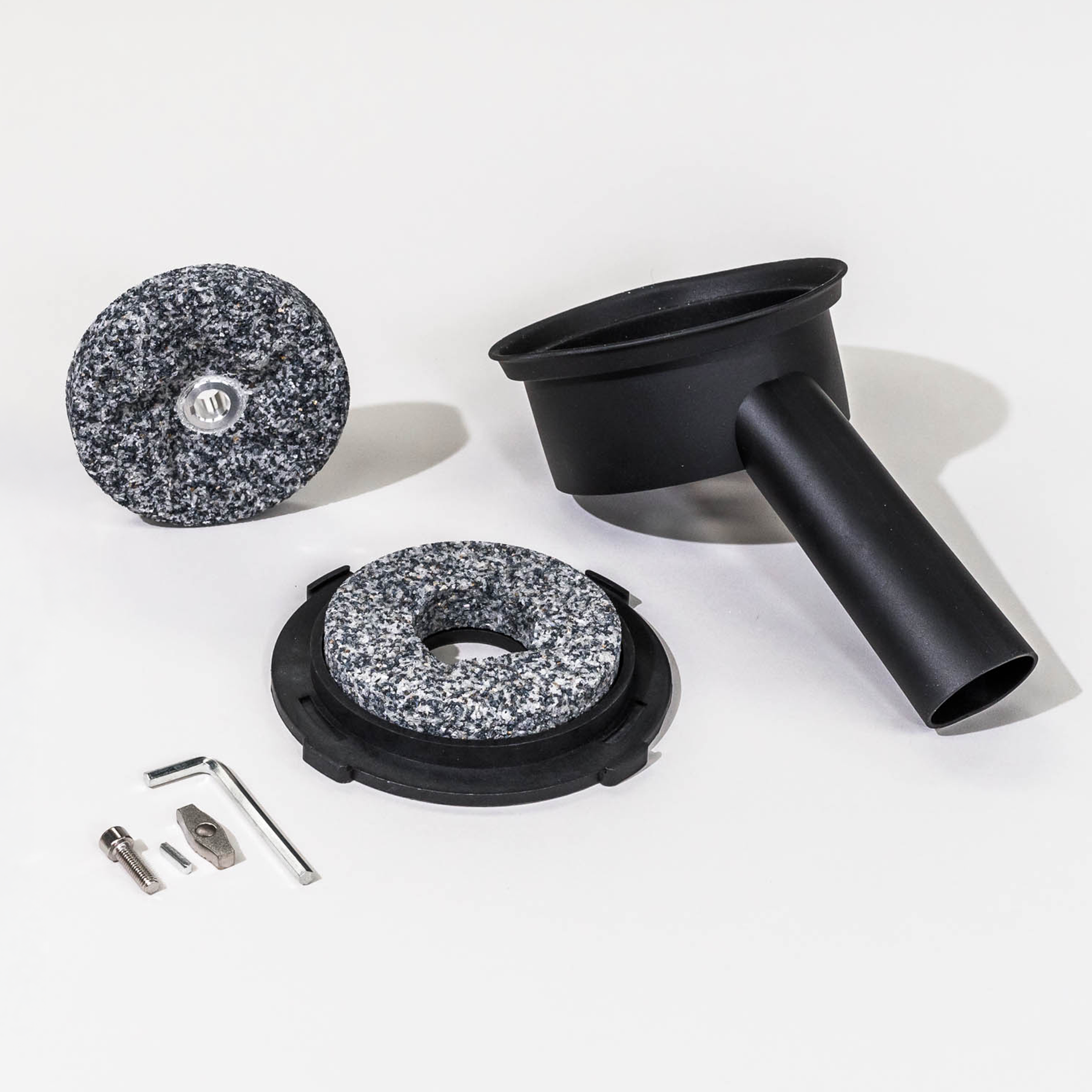 NutriMill harvest grain mill corundum stones, a flour chute, and screws and a wrench