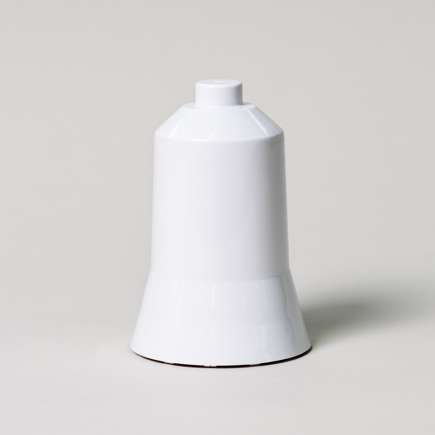 Center column for the NutriMill ice cream maker attachment on a grey background