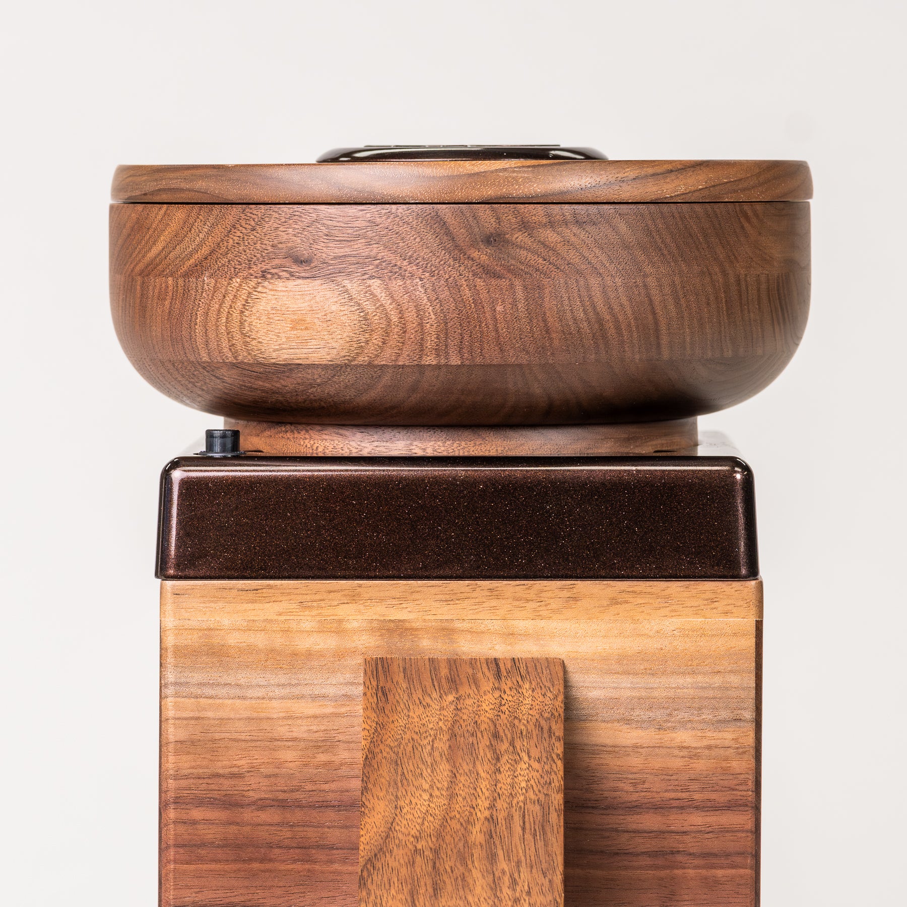 NutriMill Harvest Walnut grain mill with cocoa-colored trim on grey background