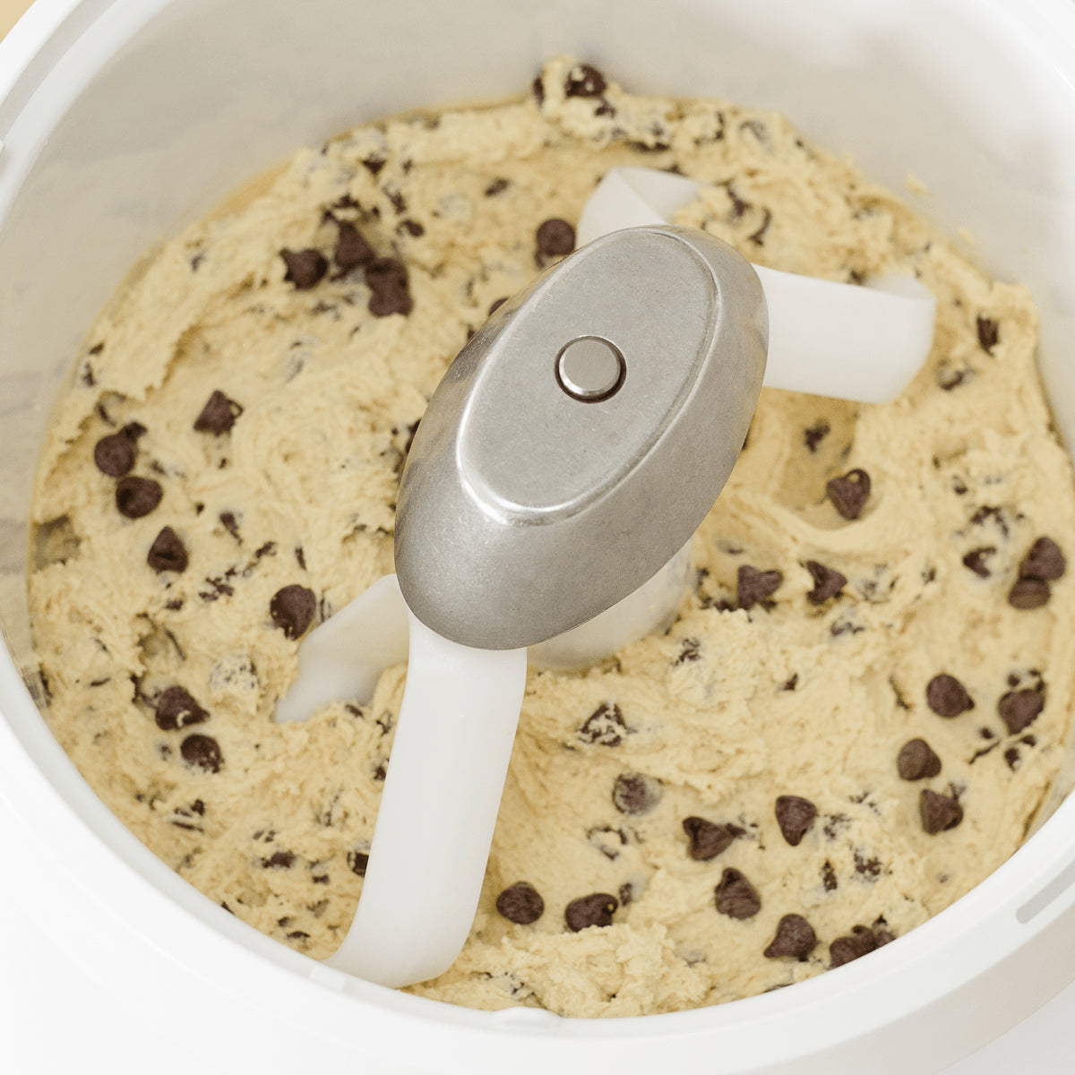 Cookie Paddles mixing cookie dough in artiste mixer bowl